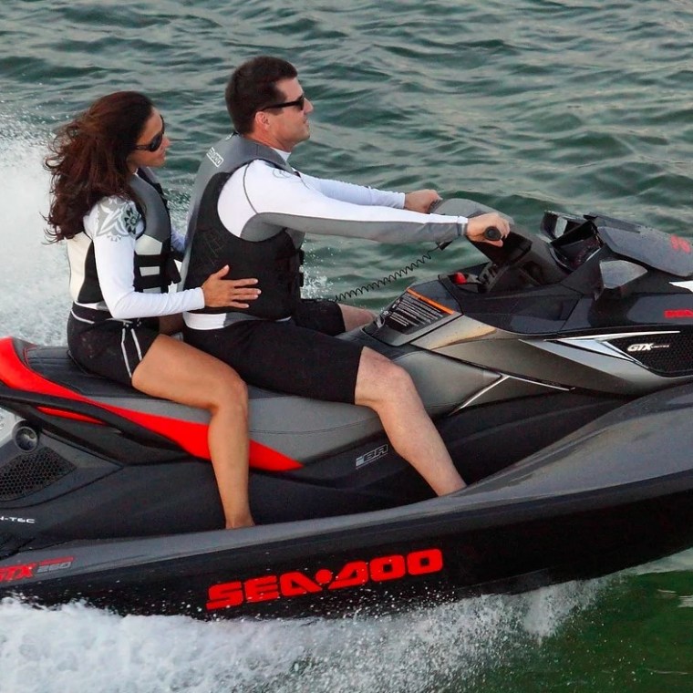 a person riding a surf board on a body of water