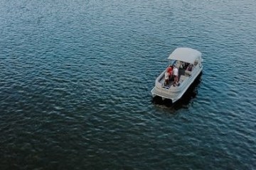 a small boat in a large body of water